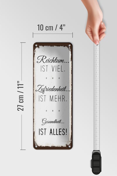 Blechschild Spruch Reichtum viel Zufriedenheit mehr 10x27cm