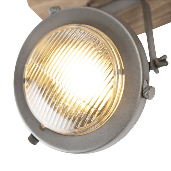 Detailansicht einer Deckenleuchte mit einem runden Lampenkopf.