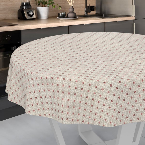Runde Tischdecke mit geometrischem Blumenmuster auf einem Tisch in einer modernen Küche.