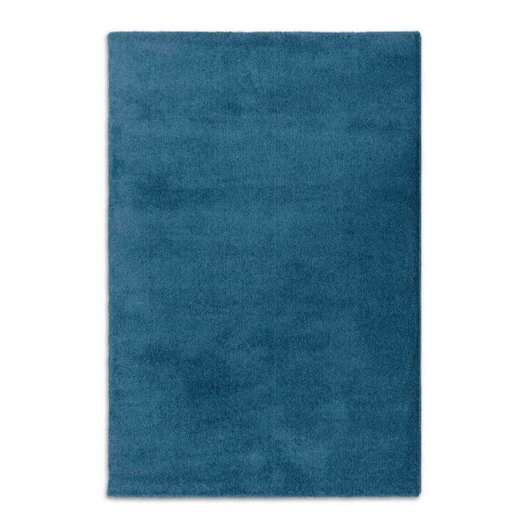 Hochflor-Teppich in Blau, rechteckig, weiche Struktur.