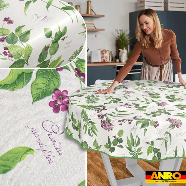 Abwaschbare runde Tischdecke mit botanischem Muster aus Blättern und Blüten in einer modernen Küche, ANRO Logo.