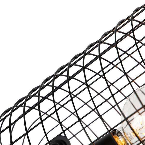 Detailaufnahme einer Lampe mit schwarzem Drahtkäfig