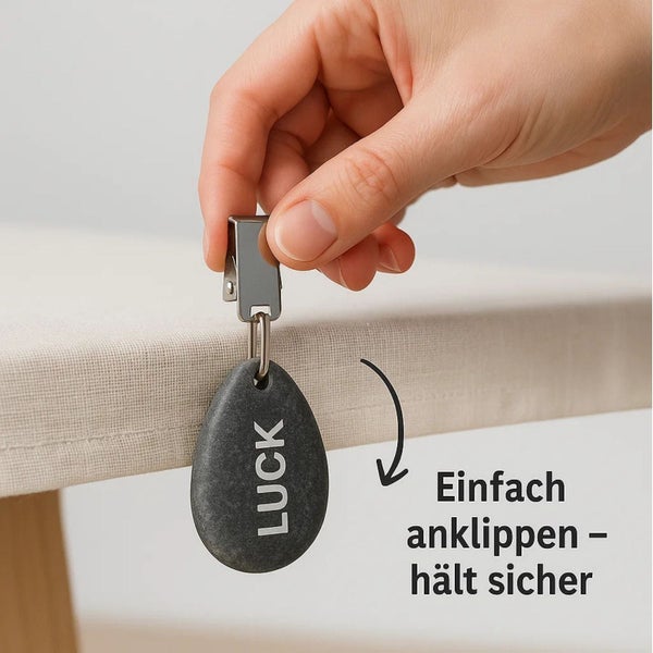 Tischdeckengewicht aus Stein mit Metallclip zur Befestigung an Tischdecken.