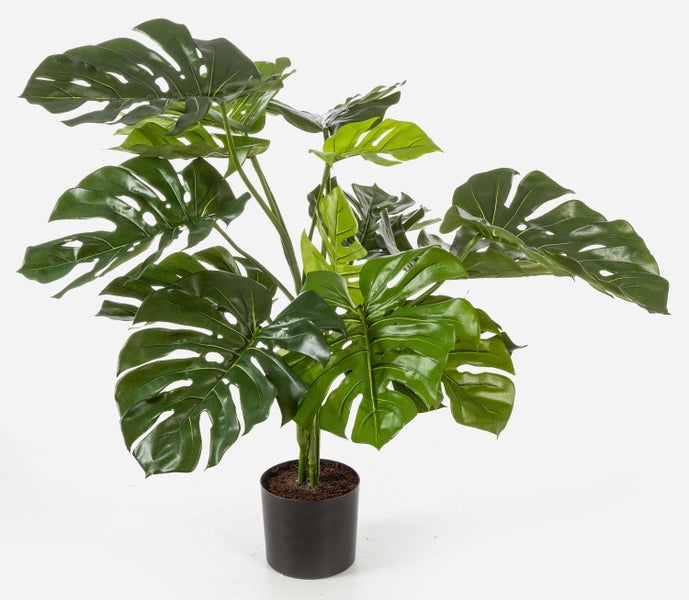 Künstliche Philodendron-Pflanze mit detailreichen grünen Blättern und Stielen in einem schwarzen Topf.