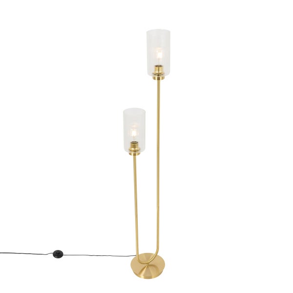 Stehlampe aus Metall und Glas neben einem Sofa