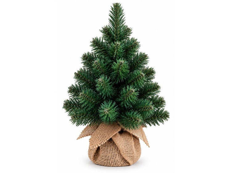 Künstlicher Weihnachtsbaum in Jutesack als Tischdekoration für die festliche Weihnachtszeit.