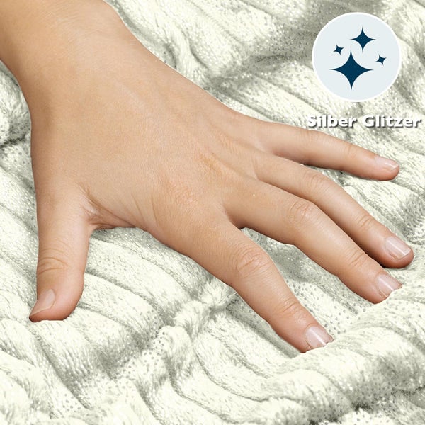 Hand auf weichem Textil mit Silberglitzer Effekt zur Dekoration