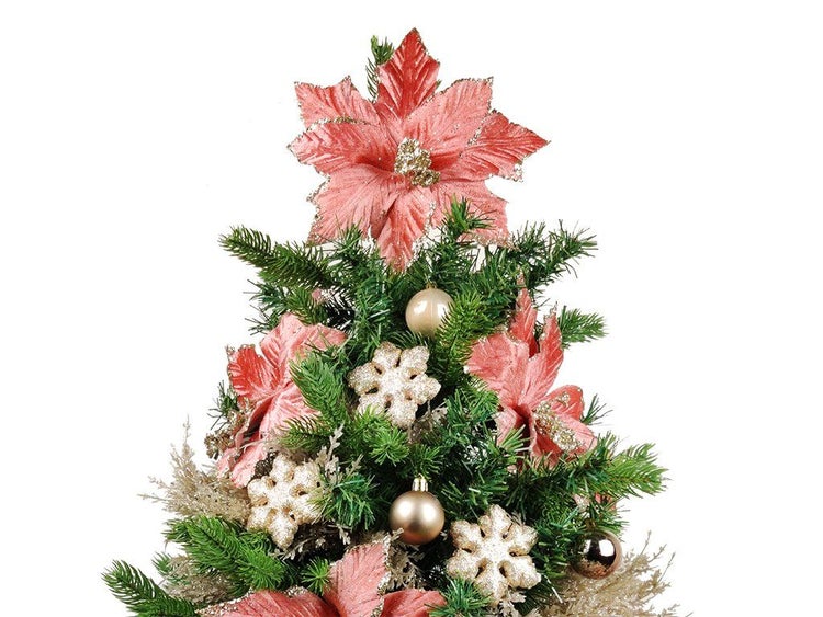 Weihnachtsbaumspitze mit künstlicher Weihnachtsblume in Sternform dekoriert für geschmückte Weihnachtsbäume