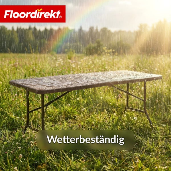 Rechteckiger wetterbeständiger Tisch auf einer Wiese im Regen mit Regenbogen