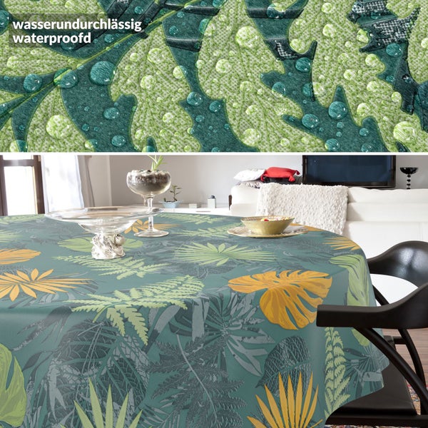 Runde, wasserundurchlässige Tischdecke mit Blattmuster im Wohnzimmer. Detailansicht zeigt wasserabweisende Oberfläche mit Wassertropfen.