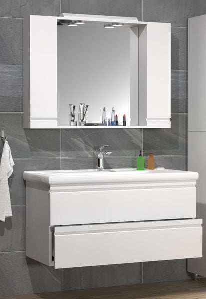Badezimmer mit weißem Waschtischunterschrank, Aufsatzwaschbecken, Spiegelschrank und Armatur vor grauer Wand