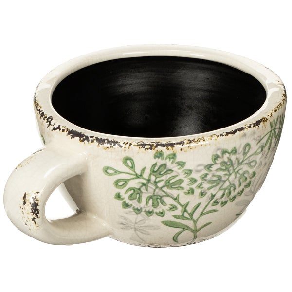 Pflanztopf in Tassenform aus Keramik mit floralem Muster und rustikalem Finish.