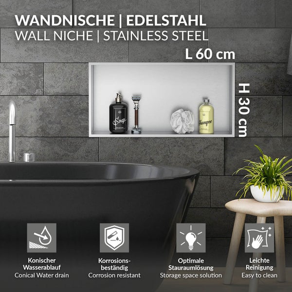 Wandnische aus Edelstahl für das Bad, 60 mal 30 Zentimeter, korrosionsbeständig mit konischem Wasserablauf, eingebaut in Fliesenwand über der Wanne.