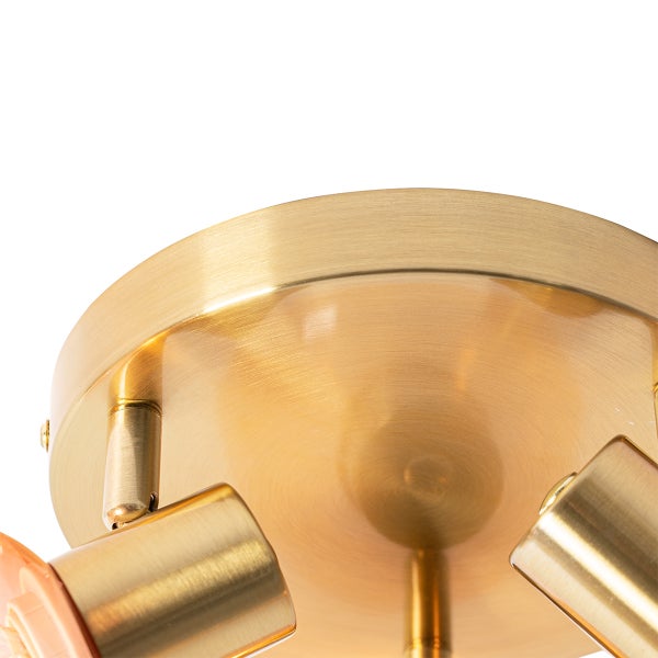 Nahaufnahme einer Deckenleuchte mit runder Montageplatte und Strahlern