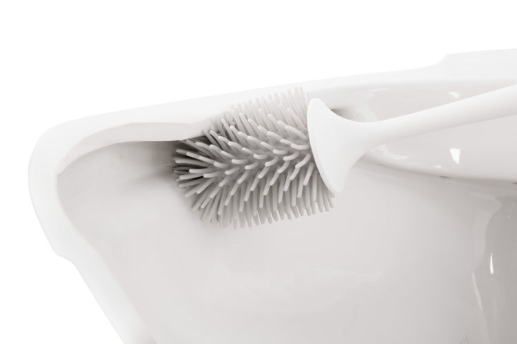 Silikon-Toilettenbürste reinigt den Spülrand einer Toilette.