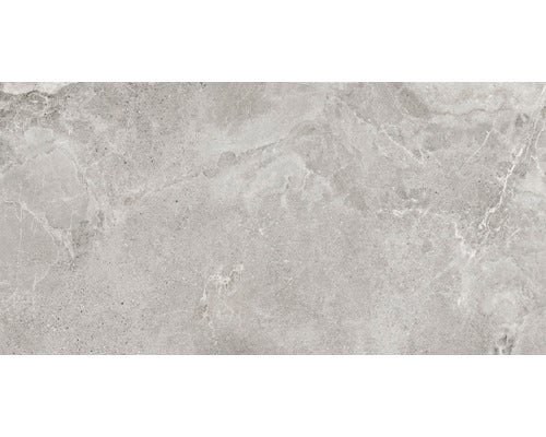 Schlafzimmer mit Bett, Nachttisch, begehbarem Kleiderschrank und Wandfliesen im modernen Stil