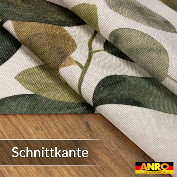 Wachstuch mit Blattmuster und Schnittkante auf einer Holzoberfläche, ANRO Logo.