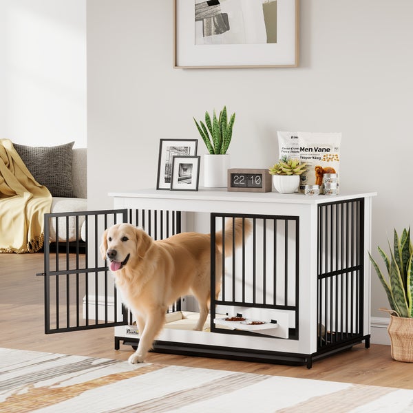 Hundekäfig im Möbeldesign aus Holz und Metall in Weiß mit integrierter Futterstation, ein Golden Retriever tritt aus der offenen Tür.