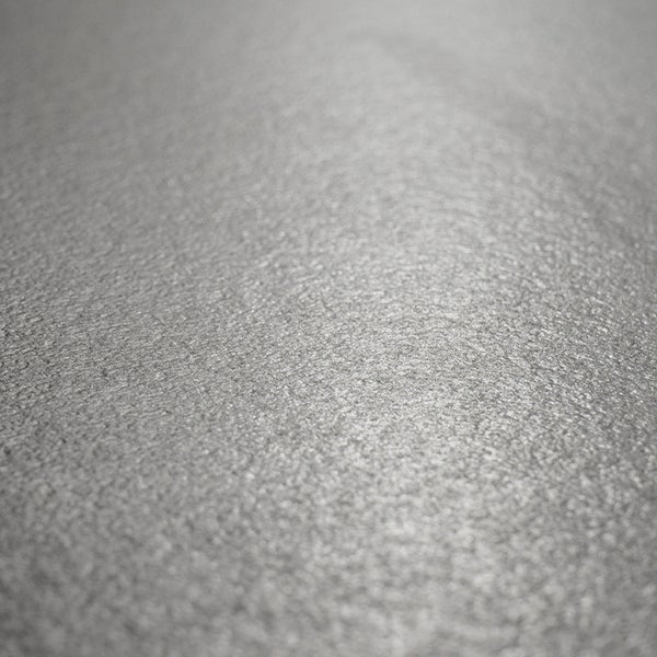 Strukturierte Oberfläche einer Fliese mit matter Textur in Nahaufnahme