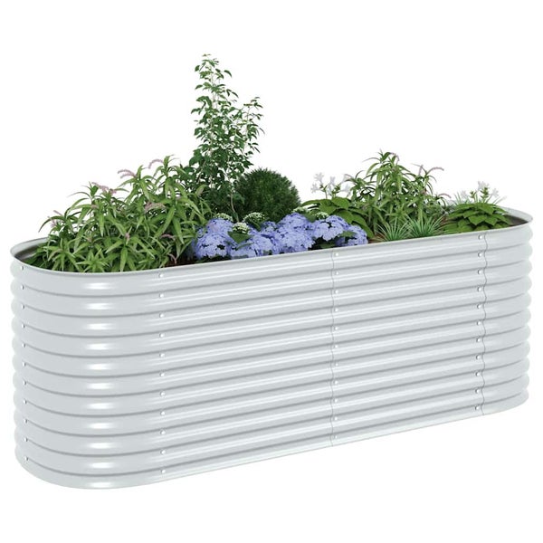 Ovales Hochbeet aus Wellblech, bepflanzt mit verschiedenen grünen Pflanzen und blauen Blumen.