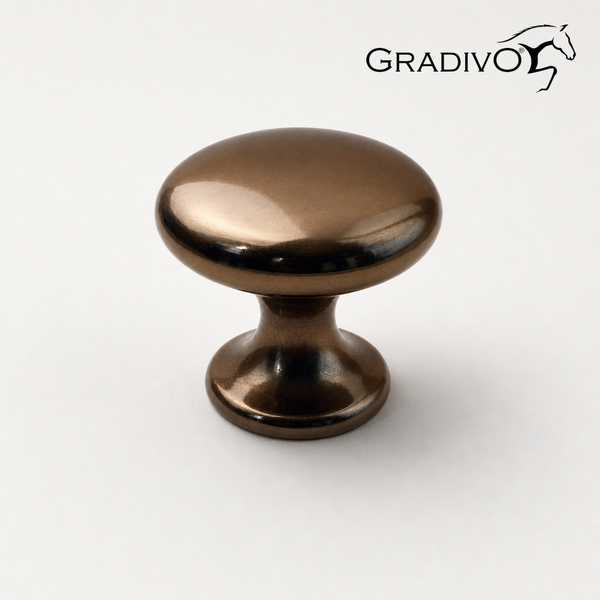Runder Möbelknopf aus Metall in Bronze-Optik mit glänzender Oberfläche und Gradivo Logo.