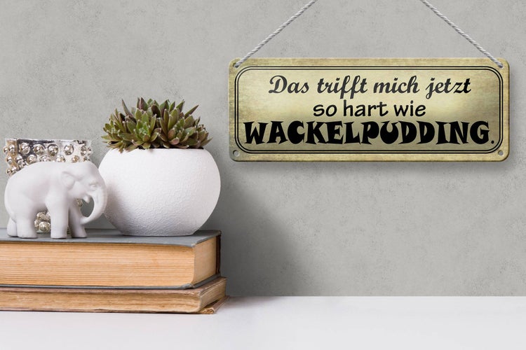 Blechschild Spruch 27x10cm trifft hart wie Wackelpudding Dekoration