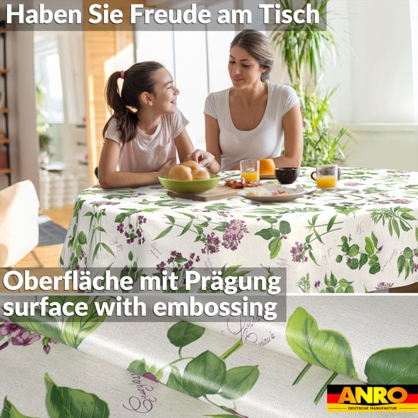 Rundes Tischtuch mit floralem Muster aus Blättern und Blüten auf gedecktem Tisch. Detailansicht der geprägten Oberfläche und ANRO Logo.