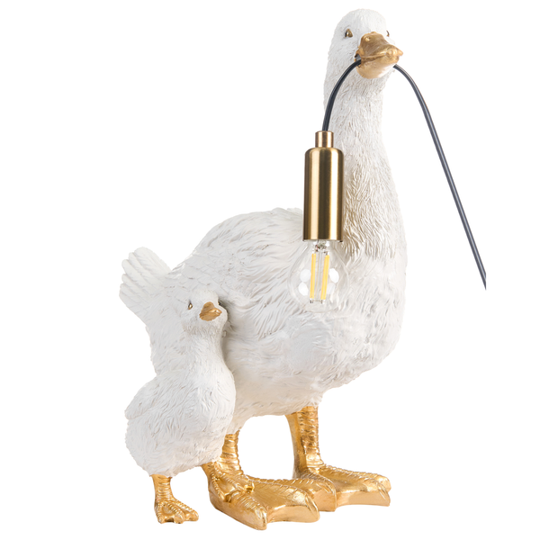 Tischleuchte Gans mit Küken, weiß mit goldfarbenen Füßen und Schnabel, hält Lampenfassung im Schnabel.