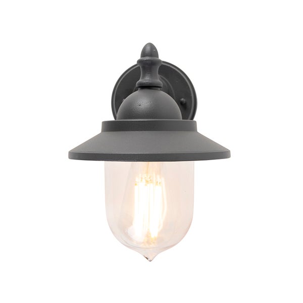 Außenwandleuchte aus dunklem Metall mit klarem Glasschirm und leuchtendem Filament-Leuchtmittel.