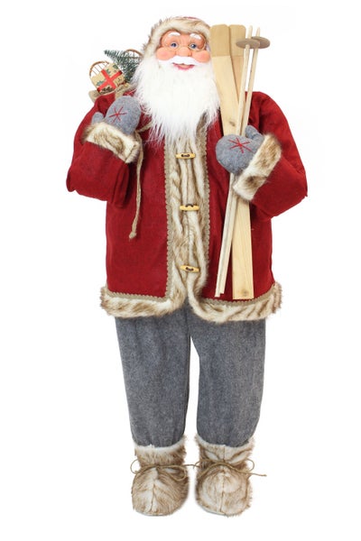 Dekorativer Weihnachtsmann mit Skiern und Geschenkesack als Weihnachtsdekoration