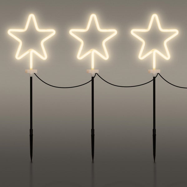 Drei leuchtende Sterne als Gartenstecker