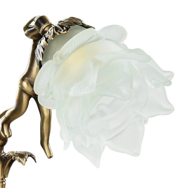 Detailaufnahme einer Tischlampe mit Blumendesign und bronzefarbenem Sockel