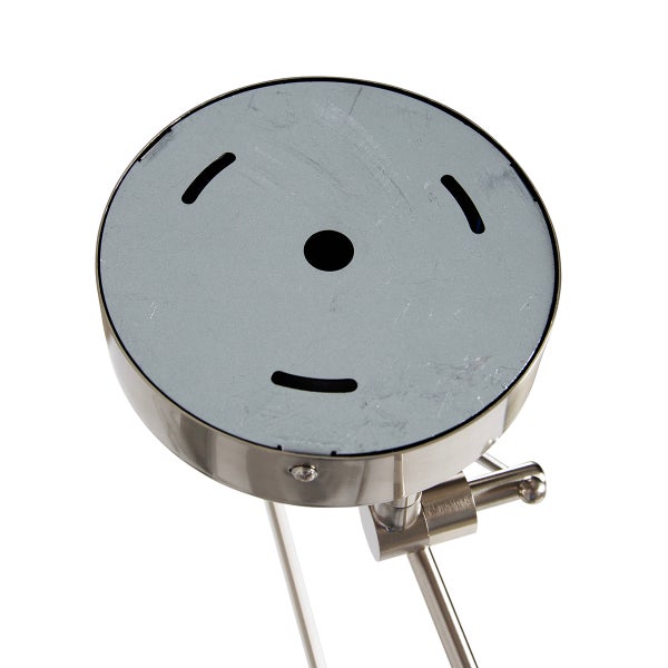 Detailansicht einer Tischleuchte mit runder Basis und Aussparungen