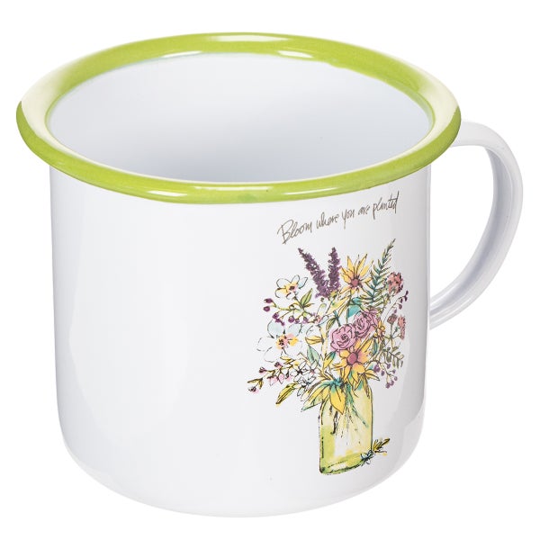 Weißer Becher mit grünem Rand und buntem Blumenstrauß-Motiv sowie dem Schriftzug Bloom where you are planted.