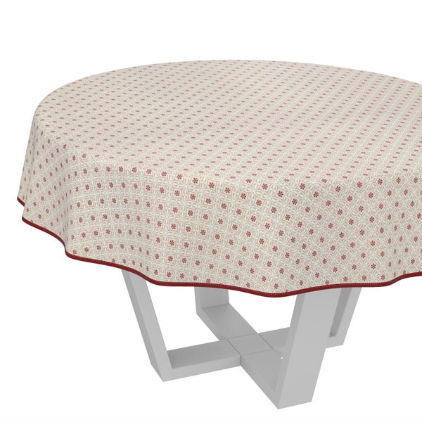 Runde Tischdecke mit floralem Muster auf einem Tisch