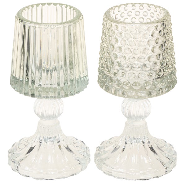 Kerzenhalter aus Glas mit Noppenstruktur auf einem Standfuß, Höhe 15 Zentimeter, Durchmesser 7,5 Zentimeter.