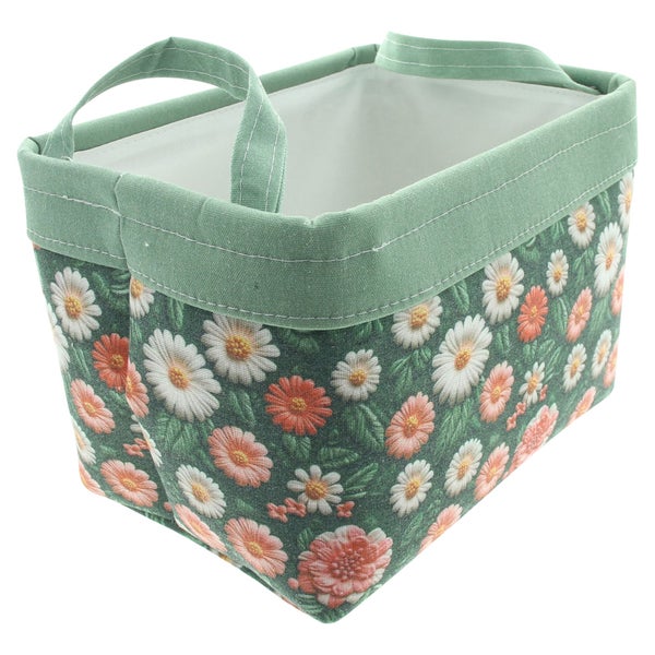 Grüner Aufbewahrungskorb aus Stoff mit Blumenmuster und zwei Henkeln.