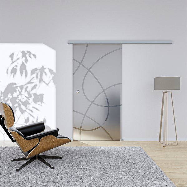 Schiebetür aus Glas mit abstraktem Design in einem modern eingerichteten Raum.