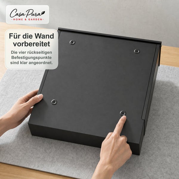 Rückseite eines Briefkastens mit vier vorgefertigten Befestigungspunkten zur Wandmontage, Casa Pura Logo.