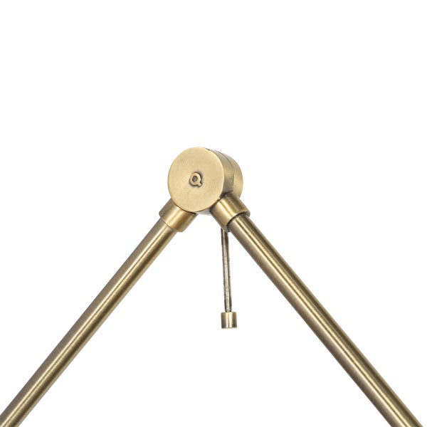 Detailansicht eines verstellbaren Gelenks einer Leuchte aus Metall in Messing-Optik.