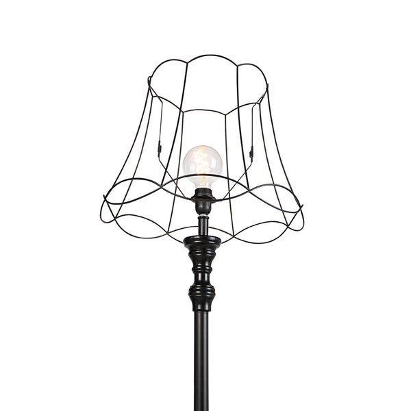 Schwarze Stehlampe mit Drahtlampenschirm und Glühbirne