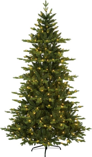 Geschmückter künstlicher Weihnachtsbaum auf Ständer