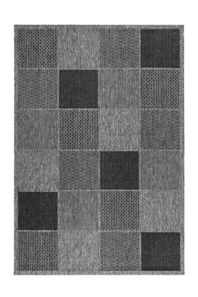 Rechteckiger Patchwork-Teppich mit verschiedenen geometrischen Webmustern in Grau und Schwarz.