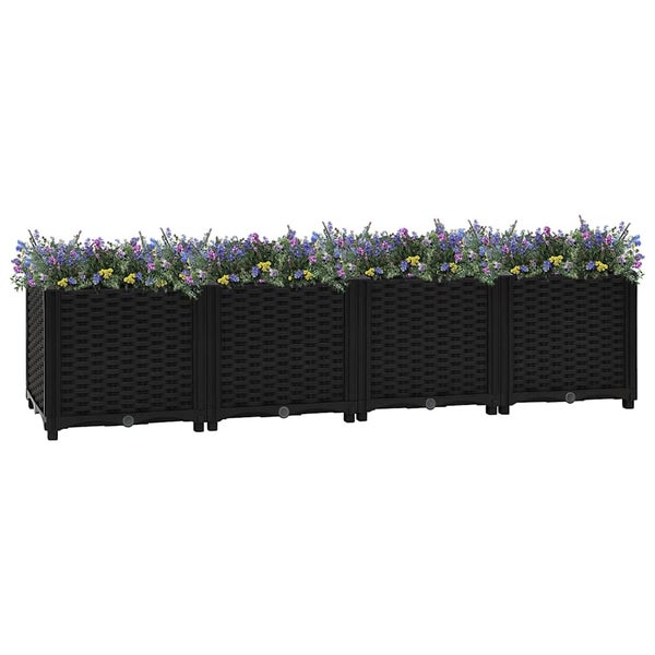Modularer Pflanzkasten in Anthrazit mit Rattan-Optik, vierteilig, bepflanzt mit bunten Blumen.