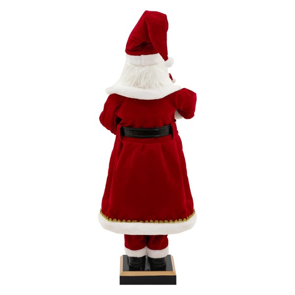 Rückansicht einer Weihnachtsmannfigur mit rotem Mantel, Mütze und schwarzem Gürtel