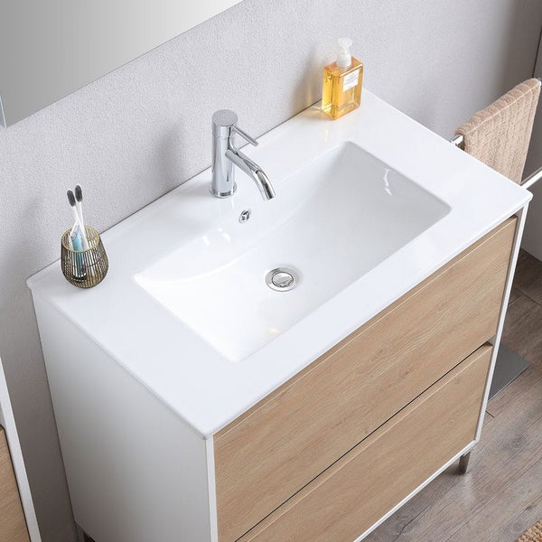 Moderner Waschtischunterschrank mit zwei Schubladen in Holzoptik, weißem Waschbecken und verchromter Armatur im Badezimmer.