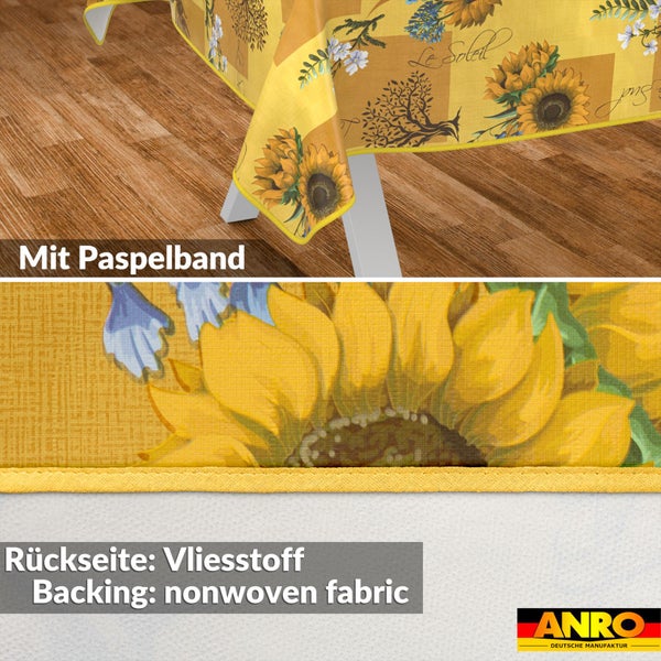 Wachstischdecke mit Sonnenblumenmotiv, Paspelband und Rückseite aus Vliesstoff. ANRO Logo.