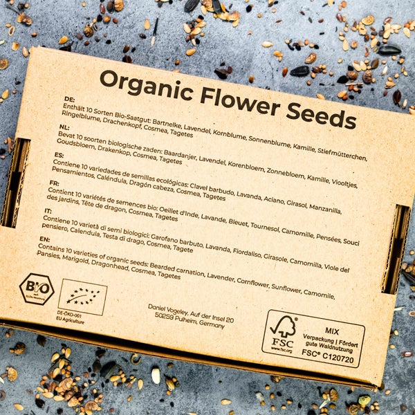 Karton mit Bio-Blumensamen für zehn verschiedene Sorten, inklusive Bio-Siegel und FSC-Zertifizierung.
