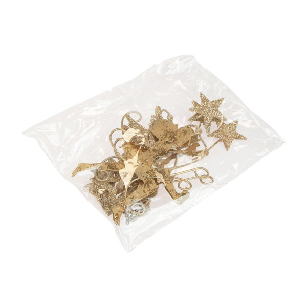 Dekorationselemente in Blattform und Sterne in einer transparenten Verpackung.