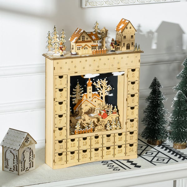 Adventskalender aus Holz mit 24 nummerierten Schubladen und einer beleuchteten Winterszene mit Weihnachtsmann und Schlitten.